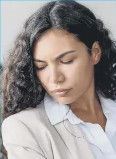  ?? ?? A photo of a young woman unhappy at work. PA