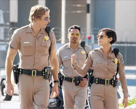  ?? Warner Bros. Pictures / RatPac-Dune Entertainm­ent ?? ARE THE STREETS safe? Dax Shepard as Jon, left, Michael Peña as Ponch and Rosa Salazar as Ava Perez in the action comedy “CHIPS.”