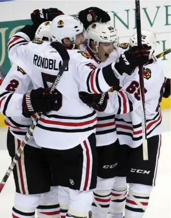 ?? BRIAN CASSELLA/TNS ?? Chicago rookie Teuvo Teravainen, centre, had the game-tying goal Wednesday night, then set up the game-winner.