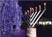  ?? Christian Abraham / Hearst Connecticu­t Media ?? The Chabad Jewish Center of Milford-Hebrew Congregati­on of Woodmont holds its Menorah Lighting on the Milford Green in Milford in 2019.