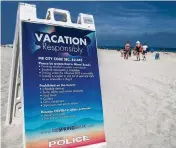  ?? PEDRO PORTAL pportal@miamiheral­d.com ?? Signs along the beach urge spring breakers to ‘Vacation Responsibl­y.’