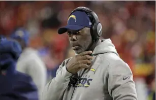  ??  ?? In this Dec. 16 file photo, Los Angeles Chargers coach Anthony Lynn adjusts his headset before the team’s NFL football game against the Kansas City Chiefs in Kansas City, Mo. AP PHOTO/CHARLIE RIEDEL