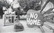  ?? Juan Figueroa / TNS file photo ?? Protesters place furniture and rally Sept. 1 outside the Dallas office of U.S. Sen. John Cornyn, R-Texas.