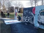  ?? MELISSA SCHUMAN - MEDIANEWS GROUP ?? The Skidmore College version of the Berlin Wall comes down, one section at a time.