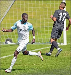  ?? SEAN D. ELLIOT/THE DAY ?? Connecticu­t College’s Uzii Dieng (7) celebrates his first-half goal against UMass-Boston during the Camels’ 2-0 non-league men’s soccer win on Saturday at Freeman Field in New London. Visit www.theday.com to view a photo gallery.