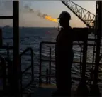  ?? Ali Mohammadi/Bloomberg ?? A man stands on an offshore oil platform in the Persian Gulf’s Salman Oil Field, operated by the National Iranian Offshore Oil Co., near Lavan island, Iran.