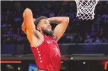  ?? ASSOCIATED PRESS ?? Minnesota forward Karl-Anthony Towns (32) goes up for a dunk during the first half of Sunday’s NBA All-Star basketball game in Indianapol­is.