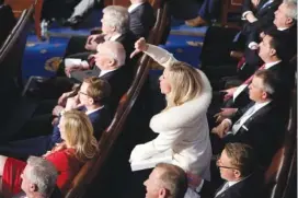  ?? AP PHOTO/PATRICK SEMANSKY ?? Rep. Marjorie Taylor Greene, R-Ga., reacts as President Joe Biden delivers the State of the Union address Tuesday to a joint session of Congress at the U.S. Capitol in Washington.