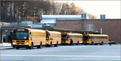  ?? GARY FOURNIER — SENTINEL & ENTERPRISE ?? School buses drop off students at Montachuse­tt Regional Technical School on Thursday, Feb. 2, 2023.