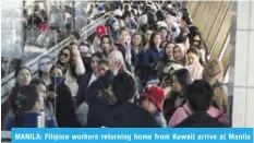  ??  ?? MANILA: Filipina workers returning home from Kuwait arrive at Manila Internatio­nal Airport yesterday. — AFP