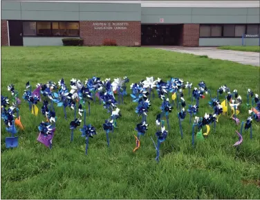  ?? FILE PHOTO ?? Blue pinwheels decorate the Madison-oneida BOCES lawn as part of Child Abuse Awareness Day a few years ago.