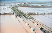 ?? PICTURE: AP ?? Flood water crosses over the Interstate 5 freeway, backing up traffic in both north and southbound lanes for hours in California.