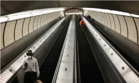  ??  ?? A near-empty escalator on the New York subway. Use of the metro system in the city has fallen by more than 90% since the coronaviru­s outbreak. Photograph: Getty