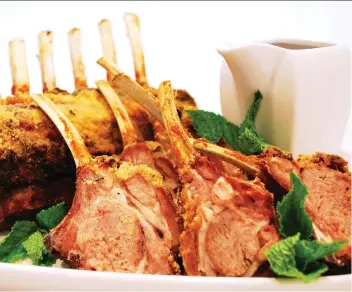  ?? PHOTOS: ATCO BLUE FLAME KITCHEN ?? A mint sauce adds festive St. Patrick’s Day green to this rack of lamb.