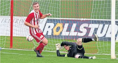  ?? ?? Formartine’s Ryan Spink scores to make it 2-0 against Turriff