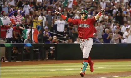  ?? ?? Joey Meneses celebrates the first of his two home runs against the US on Sunday night. Photograph: Christian Petersen/Getty Images