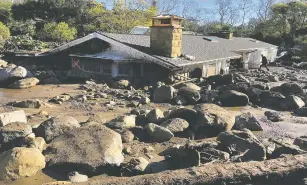  ?? MIKE ELIASON/SANTA BARBARA COUNTY FIRE DEPARTMENT VIA AP ?? Large boulders and mudflow destroyed this home in Montecito, Calif. The woman who lives there has not been seen since Tuesday.