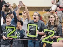  ??  ?? Students from St. Luke Catholic Elementary School cheer on their teammates at the FIRST LEGO League’s (FLL) fourth annual Hamilton qualifier at St. Mary Catholic Secondary School on Saturday.