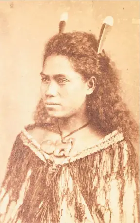  ?? Photo / Foy Bros ?? Portrait of Ma¯ ori woman with hei tiki, korowai cloak and two huia feathers (estimate $500-$1000).