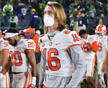  ?? (AP/Matt Cashore) ?? Quarterbac­k Trevor Lawrence was set to return for No. 4 Clemson on Saturday after a bout with covid-19, but the Tigers’ game against Florida State was postponed hours before kickoff when medical personnel from both schools could not agree it was safe to play.