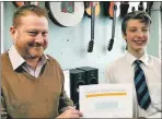  ??  ?? Julien McKenzie, principal teacher at Tobermory High, congratula­tes Jakub Marzec.