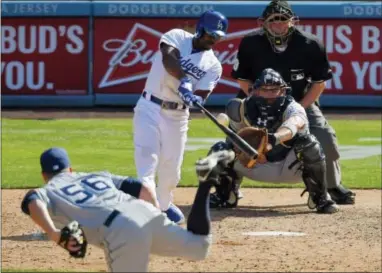  ?? MARK J. TERRILL — THE ASSOCIATED PRESS ?? Jimmy Rollins hits a three-run home run in the eighth inning to lead the Los Angeles Dodgers to a 6-3win over the San Diego Padres Monday.