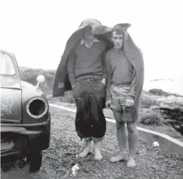  ??  ?? ABOVE FROM LEFT: On the road and raining! Cliff and Gary seek shelter; Touring – Cliff and Gary at the Crown Range summit in 1960.
BELOW: Set for the night. The two ‘racing cars’, the tent and a camping ground. How it was done in 1960.