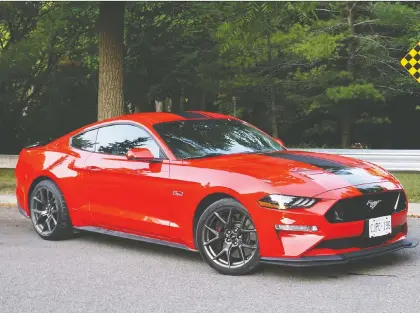  ?? BRIAN HARPER/DRIVING ?? Nick Tragianis favours the 2019 Ford Mustang GT, above, ever so slightly, over the 2019 Dodge Challenger Scat Pack 392.