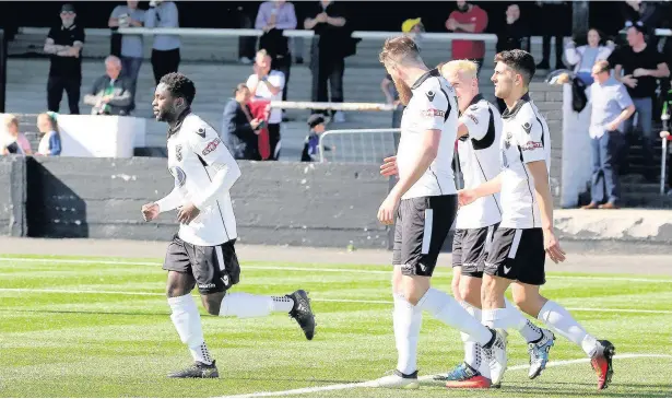  ?? PETER HARMAN ?? Kayne McLaggon walks back after scoring number four for Merthyr Town against Hayes & Yeading