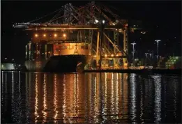  ?? THE ASSOCIATED PRESS ?? The container ship Ever Libra is moored at the Port of Los Angeles in 2022. The Commerce Department says the U.S. economy performed well in the second quarter.