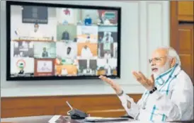  ?? ANI ?? ■
PM Narendra Modi interacts with the CMs via video-conferenci­ng in New Delhi on Monday.