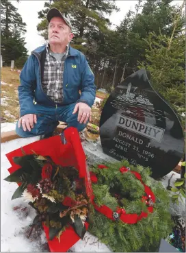  ?? Canadian Press photo ?? Tom Hearn at the gravesite of his good friend, Don Dunphy, in Mitchell's Brook, N.L., last month. A public inquiry into the police shooting of Dunphy is scheduled to start today.