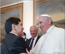  ?? (AFP) ?? Diego Maradona is greeted by Pope Francis at the Vatican City on October 12, 2016, a day before the “United for Peace” charity football match.
