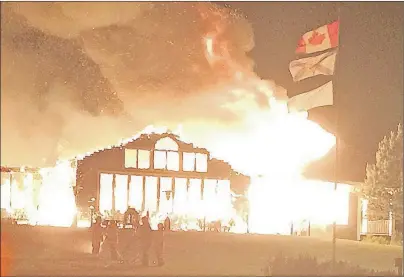  ?? SUBMITTED PHOTO ?? The clubhouse at Bell Bay Golf Club in Baddeck was destroyed by fire early Sunday morning. The blaze created an orange glow in the sky over the community.