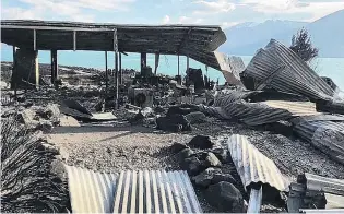  ?? PHOTO: SUPPLIED ?? Gutted . . . The fireravage­d remains of a house near the shore of Lake Ohau.