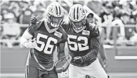  ?? BENNY SIEU/ USA TODAY SPORTS ?? Packer linebacker­s Rashan Gary (52) and Randy Ramsey work on a drill during training camp at Ray Nitschke Field.