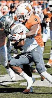  ?? CHICAGO TRIBUNE ?? Willie Parker of Eastern Michigan is tackled by Illinois players Dele Harding (right) and Tymir Oliver on Sept. 14.