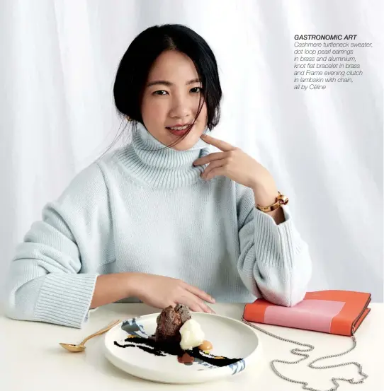  ??  ?? GASTRONOMI­C ART Cashmere turtleneck sweater, dot loop pearl earrings in brass and aluminium, knot flat bracelet in brass and Frame evening clutch in lambskin with chain, all by Céline