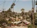  ?? Madeline Tolle/The Guardian ?? A view of Silver Lake and the neighborin­g hills from Maltman Avenue. Photograph: