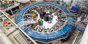  ?? The Associated Press ?? n This August 2017 photo made available by Fermilab shows the Muon g-2 ring at the Fermi National Accelerato­r Laboratory outside of Chicago.