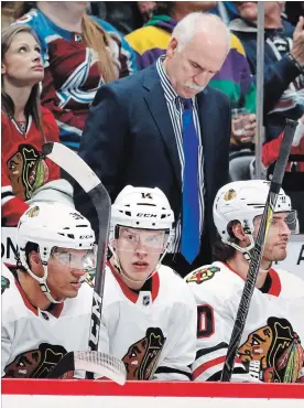  ?? DAVID ZALUBOWSKI THE ASSOCIATED PRESS ?? Despite Quennevill­e’s achievemen­ts with the Blackhawks throughout his career, including the best playoff record in franchise history at 76-52, he was fired from the team on Nov. 6.