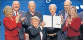  ?? AP ?? US President Donald Trump holds up an executive order he signed in Nashville on Monday.