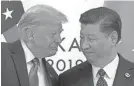  ?? SUSAN WALSH/AP ?? A U.s.-china trade deal could help President Donald Trump and Chinese President Xi Jinping strengthen their political positions back home.