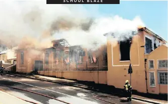  ?? SIMON SHIFFMAN ?? SCHOOL BLAZE A fire in Cape Town engulfed a section of the Holy Cross Primary School in Zonnebloem, District 6, yesterday afternoon. A newly renovated library donated by a not-for-profit organisati­on were destroyed. |