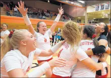  ?? KYLE TELECHAN / POST-TRIBUNE PHOTOS ?? Crown Point players celebrate their win against Penn in the 2009 Class 4A LaPorte Regional.