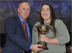  ??  ?? Lauren Caldwell receives the Principal’s Prize from Principal Kevin Joyce at the Bush Post Primary Annual School Awards.