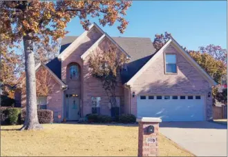  ?? JENNIFER ELLIS/Arkansas Democrat-Gazette ?? This home, located at 6916 Gap Point Circle in Sherwood, has about 2,695 square feet and is listed for $279,900 with Alicia Averitt-Haley of McKimmey Associates Realtors, North Little Rock. Today’s open house, hosted by Tonya Choate, is from 2 to 4...