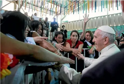  ?? PHOTO: AP ?? Pope Francis greets inmates at the San Joaquin women’s prison in Santiago yesterday during his visit to Chile.