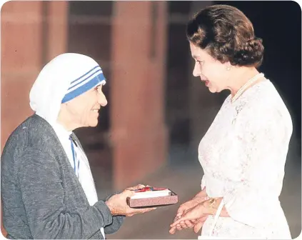  ??  ?? ■
On a visit to India in 1983, the Queen presented Mother Teresa with the Honorary Order of Merit.