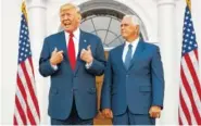  ?? THE ASSOCIATED PRESS ?? Vice President Mike Pence listens as President Donald Trump speaks to reporters at Trump National Golf Club on Thursday in Bedminster, N.J.